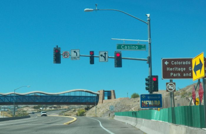 Weird traffic signal setup.
This is in Laughlin, Nevada. Well just past the river, note the welcome to Nevada sign on there. I find it weird that the center signal is no backplate. Typical setup for the southwest though, not too far off from Arizona.
