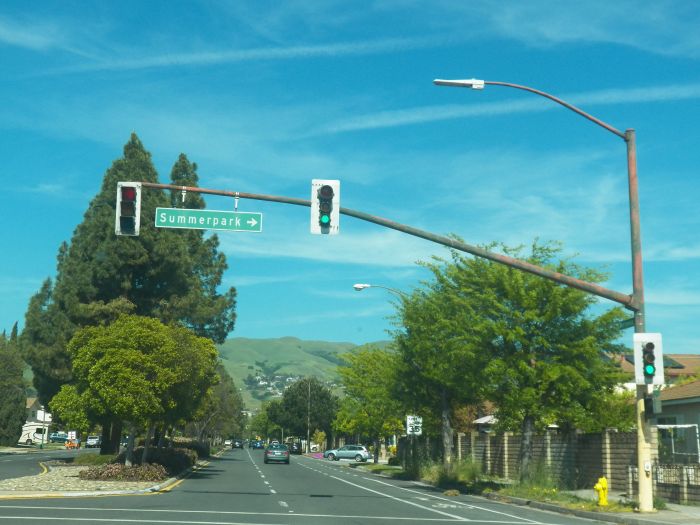 Traffic signal with old fixtures.
Seems to be a 3M that is on the side, for the arrows, Bullseye 12-8-8 signal, and another LPS light that is unknown

This was taken in San Jose, California.
