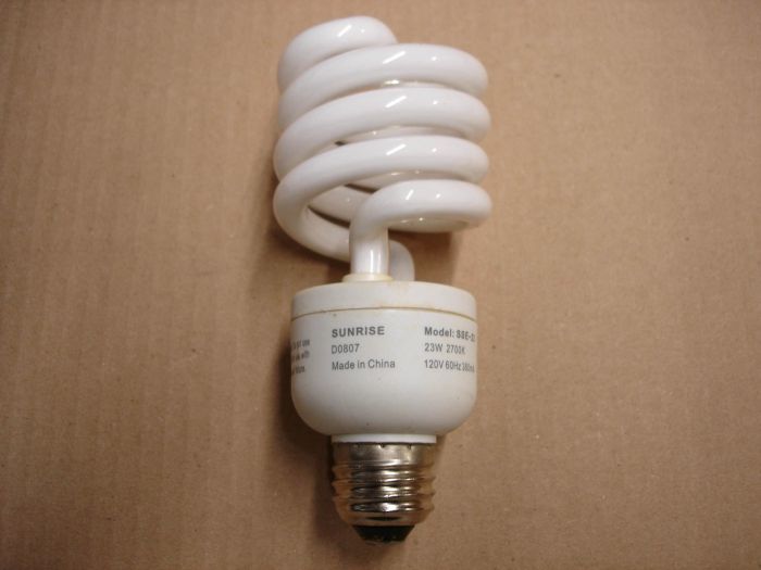 Sunrise 23W
Here is a Sunrise 23W non-dimmable warm white compact fluorescent lamp.

Made in: China

Manufactured: August 2007

Lamp life: ~10,000 hours

Colour temperature: 2700K

Lamp current: 380 mA

Voltage: 120V

Lamp shape: T4 Spiral
