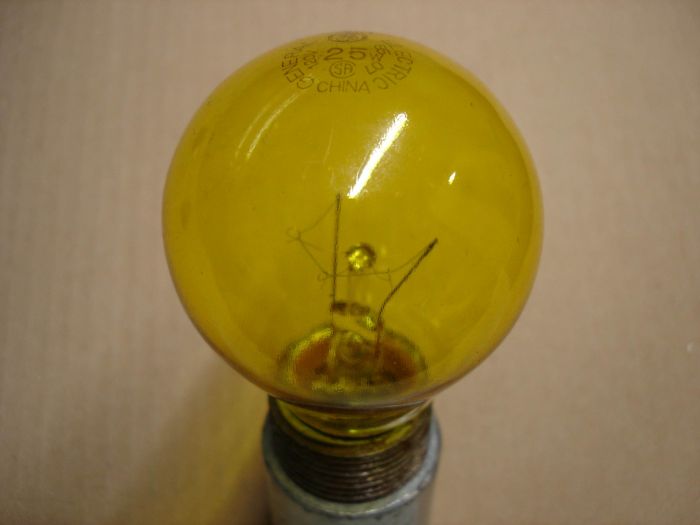 GE 25W
A General Electric 25W transparent yellow decorative incandescent lamp.

Made in: China

Lamp life: 2500 hours

Current: 0.20A

Voltage: 120V

Filament: C-9

Lamp shape: A19 short neck

