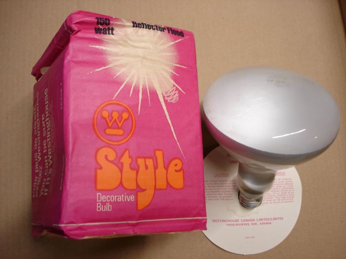 Westinghouse 150W
Here's a Westinghouse Canada 150W Style Decorator Bulb reflector flood lamp.

Made in: Trois Rivieres, Quebec Canada

Voltage: 120V

Current: 1.35A

Filament: C-8

Lamp shape: R40

Lamp life: ~1000 hours


