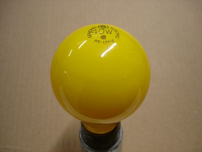 GE 40W
Here's a General Electric yellow 40W incandescent lamp. 

Lamp life: ~2000 hours

Lamp shape: A21

Filament: C-9

Base: Medium E26 brass

Voltage: 115 - 125V

Current: 0.32A
