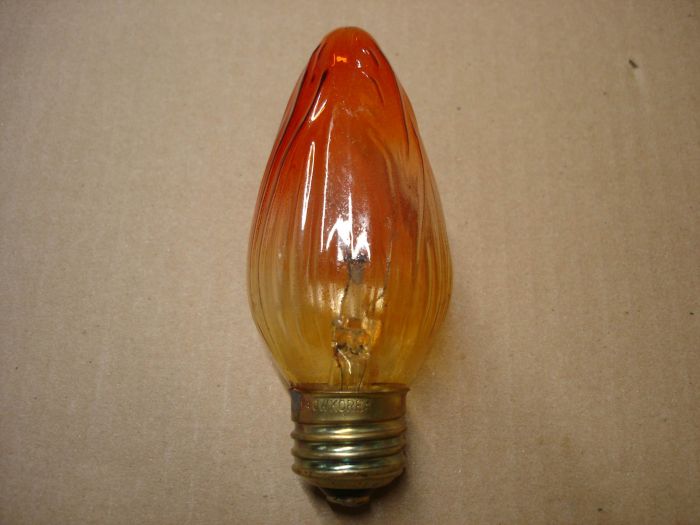 No Name 40W Amber Flame
An unknown 40W amber flame decorative lamp.

Lamp Type: Incandescent
Filament:	C-9
Base: Medium E26 brass
Shape: F15
Service Life: ~1500 hours
Wattage: 40W
Voltage: 120V
Current: 0.32A
Manufactured in:	Korea

