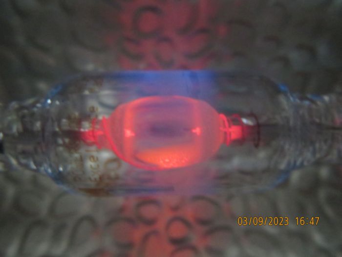 My Osram HQI-TS 70W/D shortly after turning off
You can see the UV dopants in the outerbulb afterglowing at a blue color.
