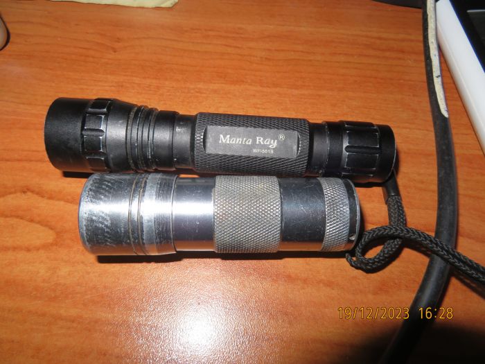 Two UV LED flashlights
The silver have 12 5mm 395nm LEDs and the black have one SMD 365nm LED.
