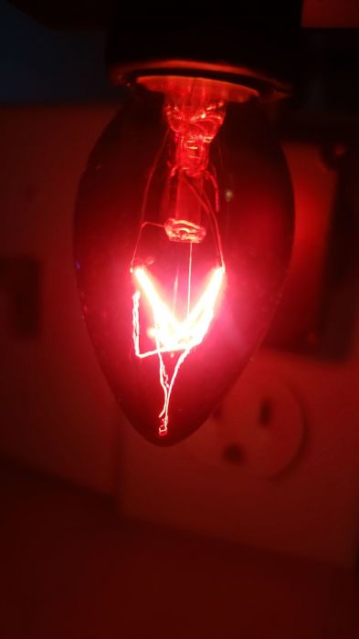 At Home transparent red C7 shaped incandescent bulb
Picture taken yesterday.

There's one of the bulbs being lit.
Keywords: Lit_Lighting