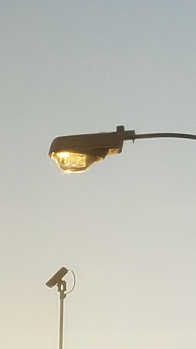 Crouse Hinds/Westinghouse 4th. Gen. OV-25 glimmers in the sunset
Picture taken Thursday.

I'm gonna try to get this fixture, because at some point, Tomball will be using LEDs soon. I'm going to try to ask CPE if they're on site doing the change out.
Keywords: American_Streetlights