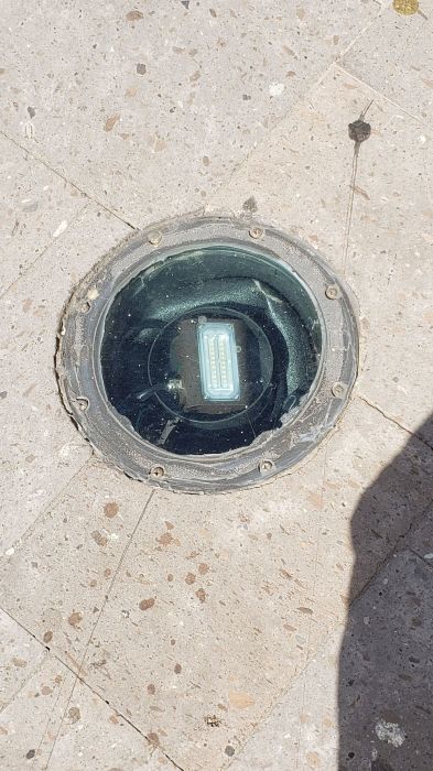 A small LED flood light in a up light fixture housing.
At a shopping center.
Keywords: Misc_Fixtures