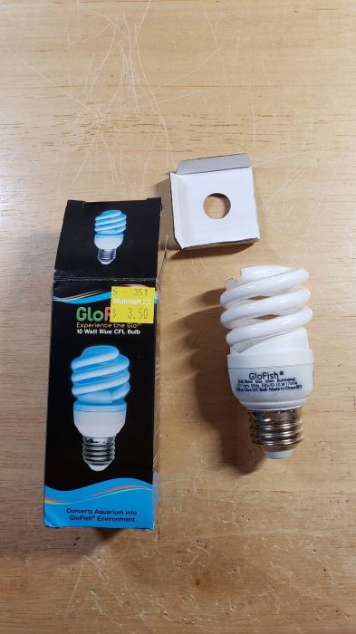 Bulb came broken out of the box! >:-(
Picture taken yesterday.

Got this Glo Fish 10w blue CFL on clearance from Walmart for $3.50, and once I opened the box, the bulb came broken! >:-( Damn it! Might as well throw it in the trash, and probably find another one that's not broken.
Keywords: Lamps