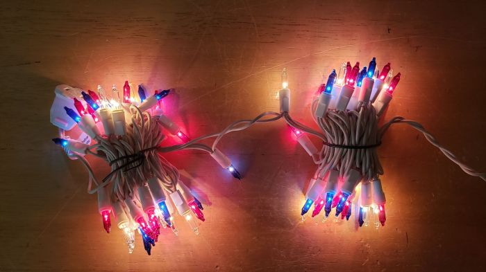 Patriotic incandescent red, clear, and blue mini lights with white wire (lit)
Picture taken on July 10, 2019.

There's the set being lit up.
Keywords: Lit_Lighting