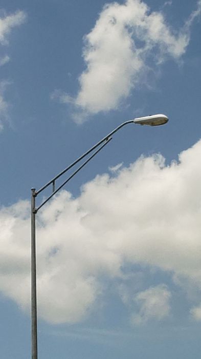 Cooper OVW 250w HPS streetlight 
At a round about intersection.
Keywords: American_Streetlights