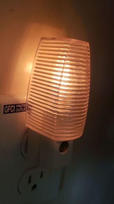 GE automatic incandescent night light (with clear bulb in it)
Picture taken on Sep 08, 2019

Same one, but with a clear bulb.
Keywords: Lit_Lighting
