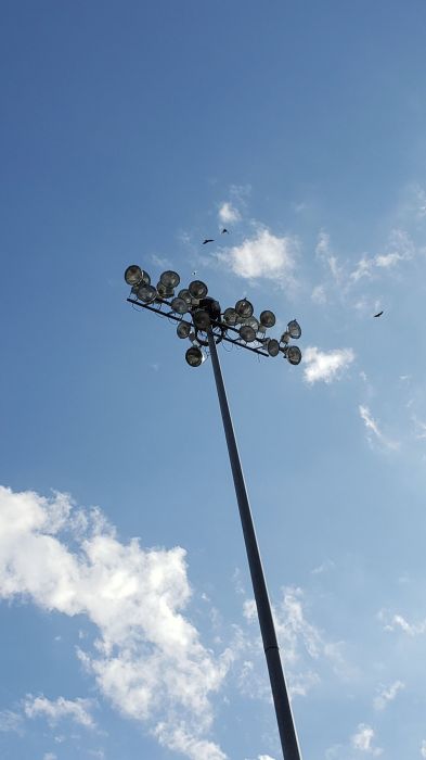 1000w metal halide stadium lighting used as parking lot lighting 
At Mattress Mack's Gallery Furniture store, in Houston, Texas. The parking lot has a lot of these.
Keywords: Misc_Fixtures
