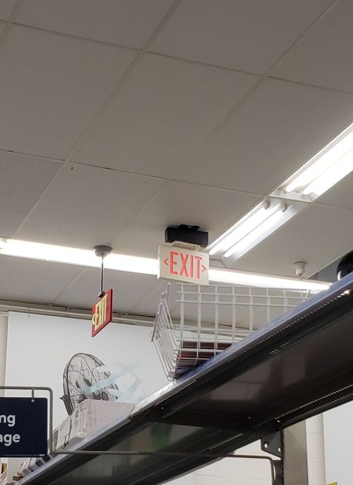 Tacky installation of a exit sign
Picture taken on Oct 26, 2019

Well, it looks like they put a Dual Lite LXURWEI (Lite Forms) exit sign below of (or part of) a Dual Lite Exquisite Series unit.
Keywords: Miscellaneous 