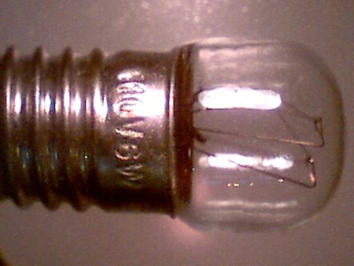Unknown 110 Volts 6 Watts E10 Night Light
Here I disassembled General Electric Incadescent Night (model number 52173) as shown at [url=http://www.jascoproducts.com/products/m/viewPrd.asp?idproduct=793&idcategory=54]GE Auto Incandescent Directional Accent Light (Clear/White Frame)[/url].  Unfortunately, the circuit of the assembly failed, but the light is still intact as shown.

This one is captured through 10x magification from Intel QX3 microscope.
Keywords: Lamps