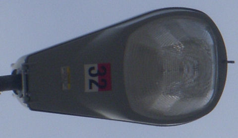 Bottom view of 115.
Here you can see the odd NEMA tag.

It is half red, half white, and it has a THIRTY TWO on it!

Anyone even know what this means? Is it metal halide? What would the wattage be?
Keywords: American_Streetlights