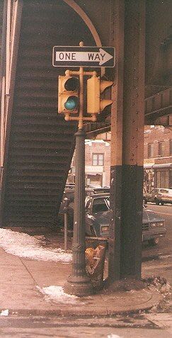 Liberty Avenue. Queens, New York.
Taken by Bob Mulero in the 1980s, this classic two-way traffic signal cluster from Ruleta was still in service on Liberty Avenue in Queens of New York. These two-section traffic signals continued to dwindle on Liberty Avenue, and the last survivors were removed from service in 2007 or so.
Keywords: Traffic_Lights