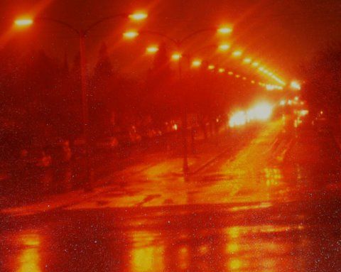 LPS lit street in the rain
I took this picture in the early 80s. I am standing on the bridge crossing the San Gabriel river looking west on Wardlow Rd. in Long Beach, CA. These lights were once series incandescent gumballs then these Norelco, now GE HPS rewired to multiple, most likly 240v.
Keywords: American_Streetlights