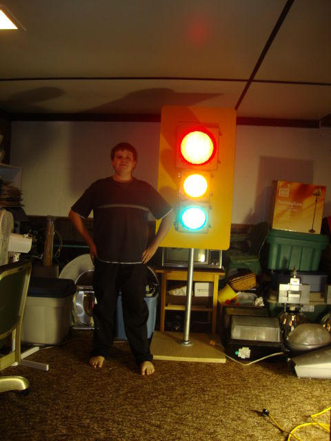 Oh Look, It's Me Again!
Well I decided I would upload a slightly better and newer picture of myself! So here it is, with me posing beside my traffic signal. And yes it is very tall! I'm 5' 8'' and it is about a foot and a half taller than me!
Keywords: Miscellaneous