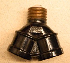 Vintage HEMCO Twin-Lite Socket Adapter
Vintage (patented 1919) 1920's,30's? twin lite socket adapter to allow 2 bulbs installed to a single existing socket.
Keywords: Lighting_History