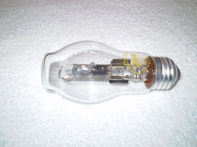 Defective Feit Electric Halogen Crystal Clear 100 Watts
Last Friday (2011-12-30) the bulb in my bedroom burned out and I replaced this bulb as shown outside of the package at [url=http://www.galleryoflights.org/mb/gallery/displayimage.php?pos=-9615]Feit Electric Halogen Crystal Clear 100 Watts[/url].  The next day I left the light on all day.  By the evening, I noticed the light is not as bright as it should be.  I took a closer look at this bulb and found deposit at the surface of the quartz tube.

I re-replaced with another Feit Halogen bulb that was sealed in the package.  To date, it has not darked the bulb.

I have a theory that the quartz somehow have been contaminated with moisture or not enough halogen filled.

I am open to suggestion for this failure.
Keywords: Lamps