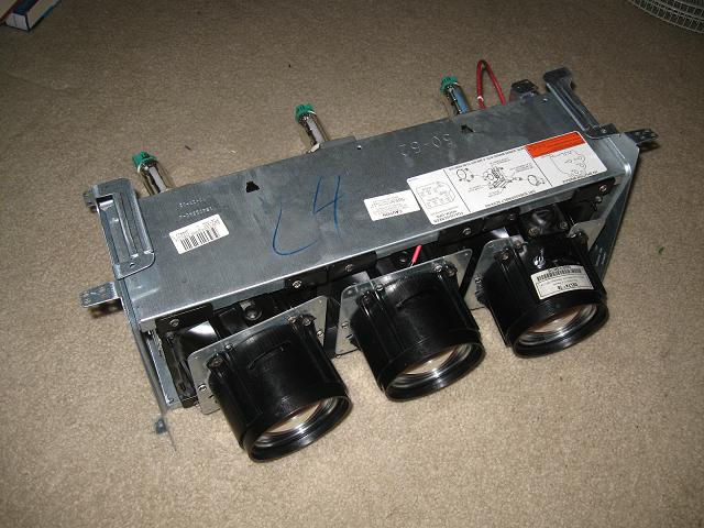 RCA D52W15B Trio of CRT Tubes
Removed from a dead 52" rear projection TV. These tubes are for generating images to be projected to the main screen. The red wire on one of the tube is the high voltage from the flyback transformer. Other two has them but not visible here.

From left to right is red, green, and blue. Red has a red filter in front of the tube while the green one is a cyan filter and the blue is a clear filter. Why is that?

The CRTs are made by Philips and are model:
Red - PLTG00RFA
Green - PLTG00RRA
Blue - PLTG00BMB
Keywords: Miscellaneous