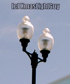 StreetLight #064
Old-style (or Acorn style) 2-lantern streetlight

Location: Arapahoe & University, Centennial CO
(note image isn't the best as it was taken while in a car)
Keywords: American_Streetlights