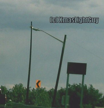 StreetLight #174 - Not Quite Straight?
Certainly not the best job on getting the pole installed vertically straight LOL (either that or it was hit/moved)
Looked to me like its a temporary install anyway, so I doubt they care.

(image was taken from a moving car & a bit of distance, so not the best quality)


Location:
Near Highway 36,  Boulder, CO
Keywords: American_Streetlights
