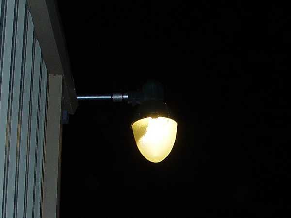 Line Material "Teardrop" at night
Restored Line Material "Teardrop" back in service using a 300 watt equivalent CFL.  (At 68 watts these high output CFLs make using the old pendant luminaires affordable for area lighting.)
Keywords: American_Streetlights