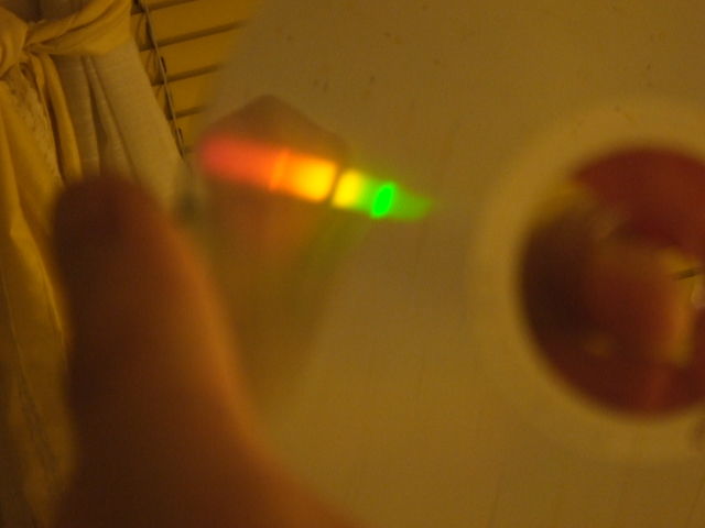 Sodium spectrum part of a HPS discharge
The sodium part of the HPS spectra.
Two mercury lines are present:the yellow, at around 575nm, and green at about 540nm.
The sodium D-line (589nm) emission is also signified by a dark spot in yellow region.
Keywords: Miscellaneous