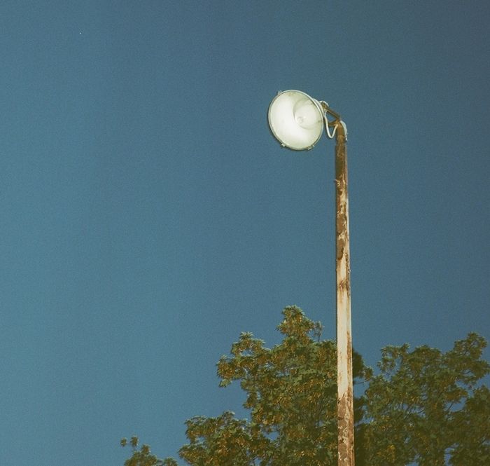 Mercury Vapor floodlight
This is at an older gasoline station in Queens, NY. The ballast and capacitor are hanging out of the pole's base, and it doesn't light. I wonder if it was originally incandescent.
Keywords: American_Streetlights