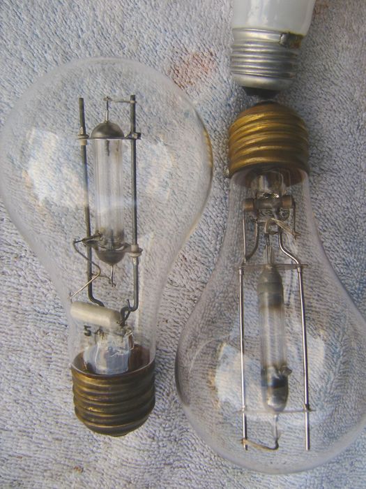 S-4 100w Mercury Vapor bulbs
GE-Mazda (left), Westinghouse (right)
These old mercs were used in 1940s? sunlamps. A pic of the Westy lit was posted earlier. They have weird bases which are a bit larger than the standard edison base shown in the pic.
Keywords: Lamps