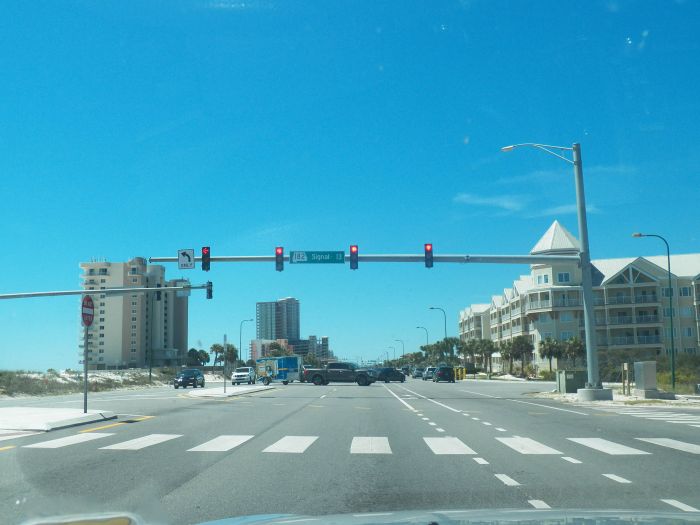 Traffic signal setup with OVD in Orange Beach, Alabama
Nothing entirely too special on this one, the sign has the road marker of the road I was traversing, interesting signage I would say the least with how the block was named, "signal 13" I guess they have their own way of doing things. No cool streetlights though, just some induction like things in the background.
Keywords: American_Streetlights