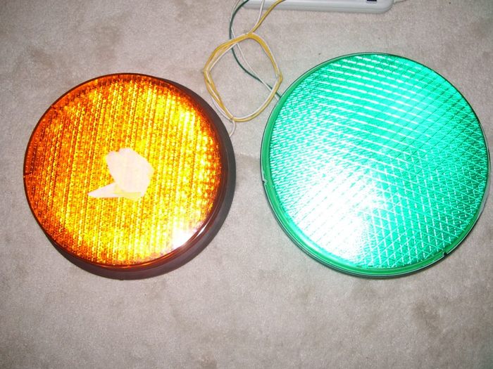 LED Traffic Signal Modules 
Here's a couple of traffic signal modules that I recently found at a surplus store, the one on the left is GE amber light like [url=http://www.galleryoflights.org/mb/gallery/displayimage.php?pos=-1604] this one[/url] in Vince's collection and the one on the right is a Dialight green light. 

(Note: I used to call them lenses but have renamed the title to modules)
Keywords: Traffic_Lights