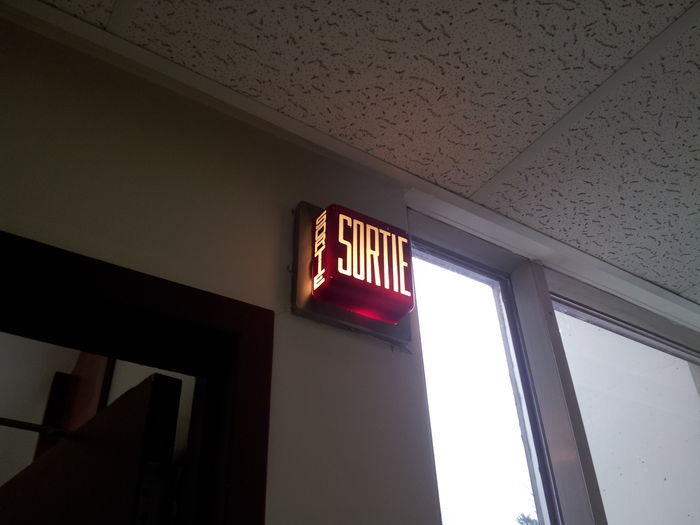 Old wall-mounted exit sign.
That's a weird one! Probably still incandescent too!
Keywords: Indoor_Fixtures