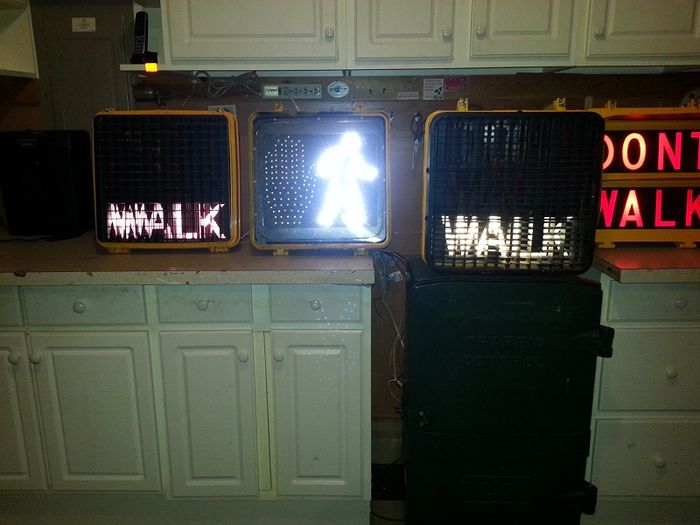 "WALK"
The General Traffic Equipment model P-6 (to the left) controls the cross street of my collection along with the Cooper LED/AtLite Inc. hand and man insert and Winko-Matic VI 2L pedestrian signal.
Keywords: Traffic_Lights