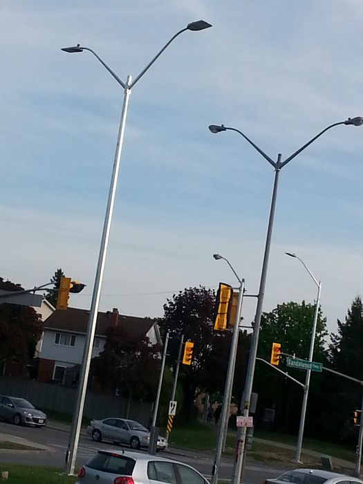 New LED's for intersection upgrade
Today I watched this LED come up as well as the one on the other side of the street. AE Autobahn LED's . The new pedestrian signals are not using the round piping for mounting but instead using rectangular ones. This is the first signal upgrade intersection here that uses LED streetlights. Hopefully the OVX's on this street get replaced with LED's. There are more intersections nearby that are being replaced this year. Im assuming a similar setup will be used at the other lights.
Keywords: American_Streetlights