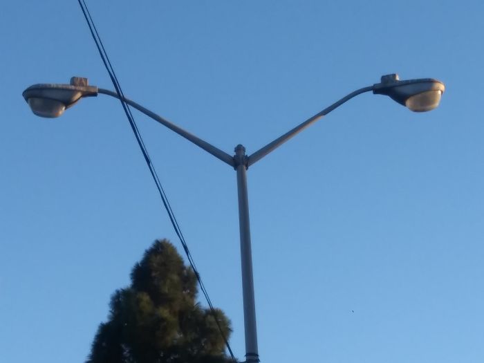 2 Revere 2700 Superoval 400w Metal Halide Streetlights
In a parking lot in San Jose, CA.
[img]https://i.postimg.cc/5y3hSgRf/20180929_182743_1.jpg[/img]
Keywords: American_Streetlights