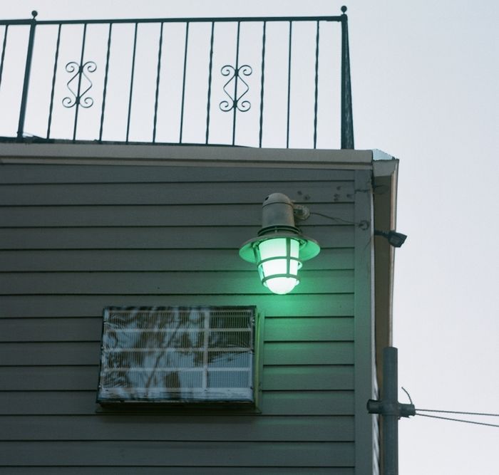 Nicely greened-out MV 
This decorates the building of an electrical contractor near my home. 
Keywords: Lit_Lighting