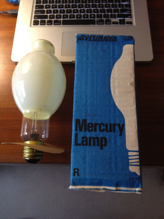 NOS Sylvania 400w Mercury Vapor lamp
Got this on eBay to use in a certain fixture. NOS Sylvania 400w Mercury Vapor DX coated. Unfortunately, the lamp is broken. One of the connections on the starting resistor broke off. Still, it's a cool looking lamp.
Keywords: Lamps