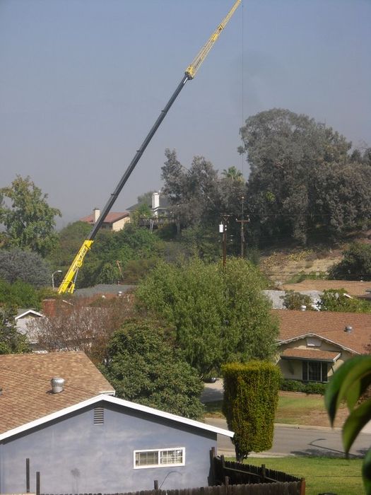 Power Pole Replacement
A large crane to lift the old pole out and new pole in over houses. Done for So Cal Edison by contractors. This is in West Covina, CA
Keywords: Miscellaneous