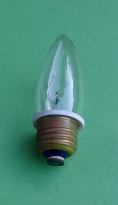 Torpedo with a Power Reducer
Small button on bottom contact I believe is a diode to half wave the filament power. It's a 60 watt Korean made bulb, but measures 30w on a Kill-A-Watt. The white ring is an insulator.
Keywords: Lamps