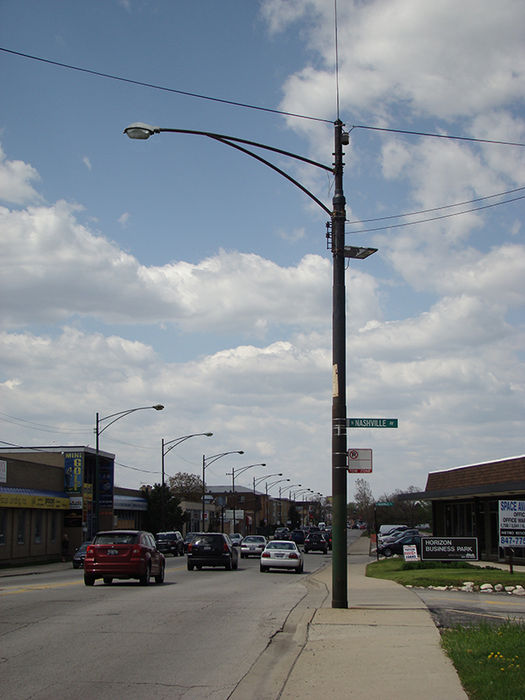 OV20s On Irving Park Rd.
OV20 in foreground on trolley pole which, until the mid-50's held either a Radial Wave or Gumball Light. From early '77 to today a Crimefighter, a Chicago standard, hangs from this pole.
Keywords: American_Streetlights