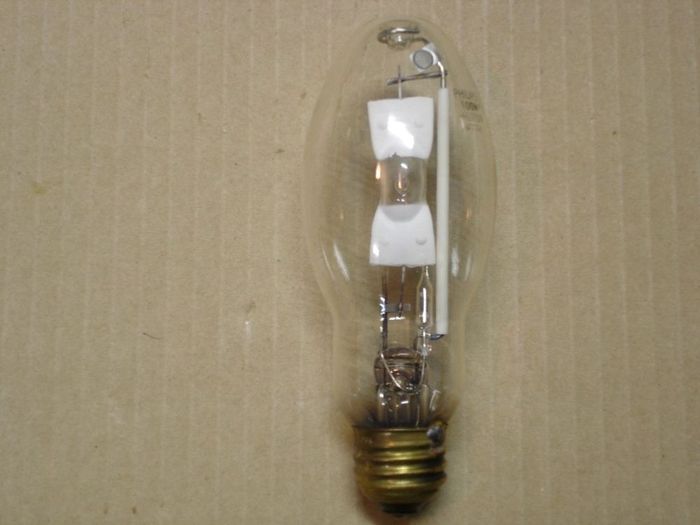 Philips 100W Metal Halide
A clear Philips 100W metal halide lamp with a miniature bulb shaped starting aid.
Manufacture date: Apr. 1997
Colour temp: 4300K
Lumens: 5850
Lamp shape: BD17
Made in: USA
Lamp life: 16000 hours
Keywords: Lamps
