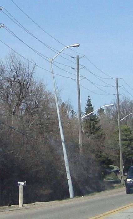 Very Crooked Pole  
Look at this! Its ready to fall over.
Keywords: American_Streetlights