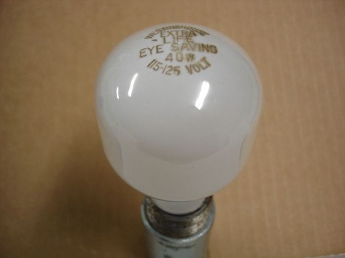 Westinghouse 40W
Here's a Westinghouse Extra Life Eye Saving 40W lamp.

Voltage: 115-125V
Current: 0.33A
Date: 70's to 80's
Filament: C-9
Lamp shape: T19
Base: medium E26 Aluminum
Keywords: Lamps