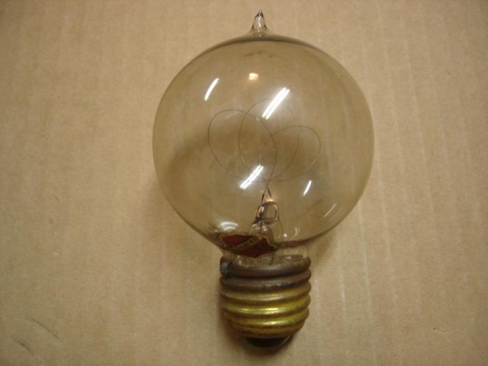 Banner Carbon Filament Lamp 
Here is a Banner 16 candle power carbon filament lamp from around 1918.
Voltage: 104V
Current:
Date: Circa 1918
Filament: Carbon triple loop
Lamp shape: G19
Base: Medium E26 brass
Keywords: Lamps