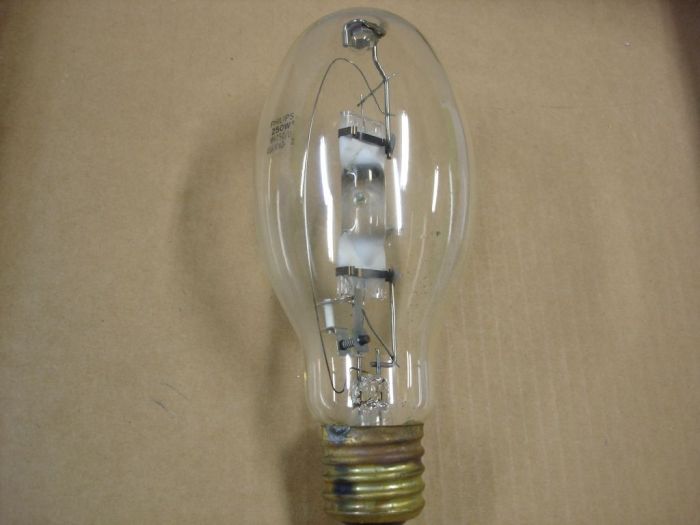 Philips 250W Metal Halide
Here is a Philips clear 250W probe start metal halide lamp.
Manufacture date: Oct. 2000
Colour temp: 4000K
Lumens: Initial 21250  Mean 14875 
CRI: 65
Base: Mogul E39 brass
Lamp shape: ED28
Made in: USA
Lamp life: 10000 hours
Ballast: M58
Keywords: Lamps