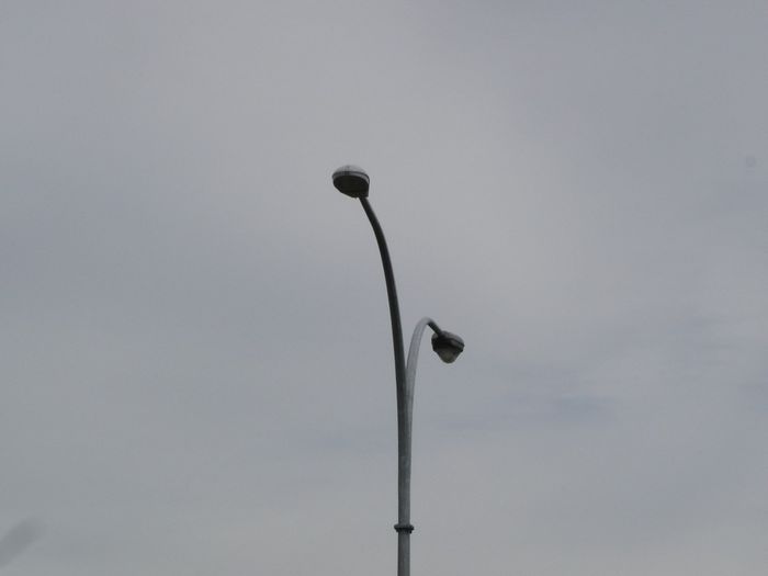 Test Patch
Here's a pic of one of the induction cobra heads in a test patch at a rest stop with the LED's on the same double Davit pole as the existing Landmark 250W HPS fixture (Canadian version of the AE 325 powerpad).
Keywords: American_Streetlights