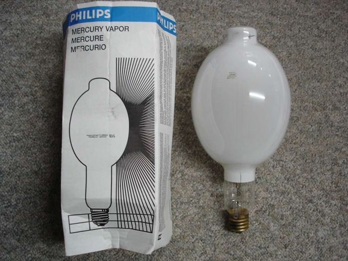 Philips 1000W Mercury Vapour
Here's a Philips coated 1000W mercury vapour lamp.
Manufacture date: Mar. 2000
Colour temp: 3700K
Lumens: 63000
CRI: 45
Base: Mogul E39 Brass
Lamp shape: BT56
Made in: USA
Lamp life: 24000+ hours
Ballast: H36
Keywords: Lamps
